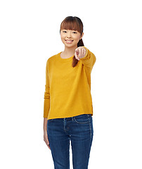 Image showing happy asian young woman pointing finger on you