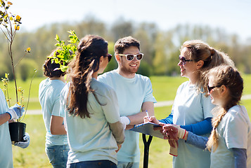 Image showing group of volunteers planting trees in park