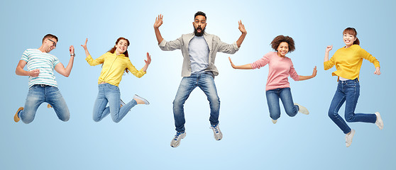 Image showing international group of happy people jumping