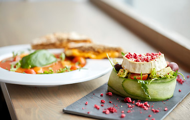 Image showing goat cheese salad and gazpacho soup at restaurant