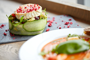 Image showing goat cheese salad with vegetables at restaurant