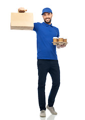 Image showing happy delivery man with coffee and food in bag