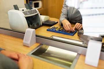 Image showing clerk counting cash money at bank office