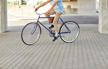 Image showing hipster man riding fixed gear bike