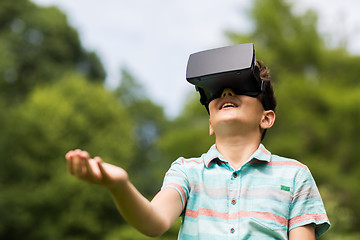 Image showing boy with virtual reality headset outdoors