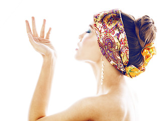 Image showing young pretty modern girl with bright shawl on head emotional posing isolated on white background, asian people ethnicity