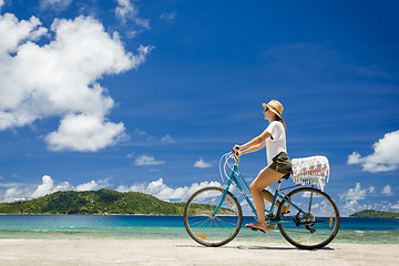 Image showing Woman ride along The Beach