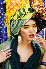 Image showing beauty bright woman with creative make up, many shawls on head l