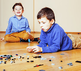 Image showing funny cute children playing at home, boys and girl smiling, first education role lifestyle