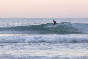 Image showing Body surfer riding a perfect wave.