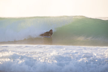 Image showing Body surfer riding a perfect wave.