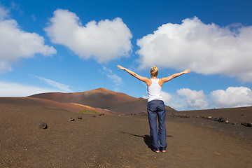 Image showing Woman tracking to top of mountain.