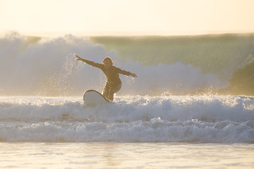 Image showing Body surfer riding a perfect wave.