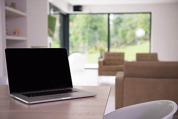 Image showing Notebook with blank screen on table