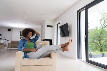 Image showing african american woman at home with digital tablet