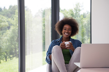 Image showing African American woman in the living room