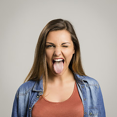 Image showing Woman with tongue out