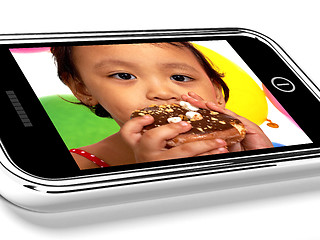 Image showing Mobile Phone Picture Of Kid Eating A Donut