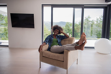 Image showing black women at home in the chair