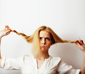 Image showing young blond woman on white backgroung gesture thumbs up, isolate