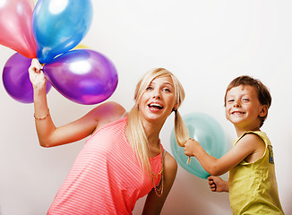 Image showing pretty real family with color balloons on white background, blon