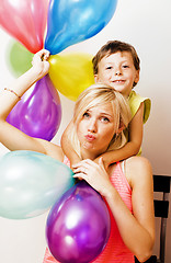 Image showing pretty real family with color balloons on white background, blon