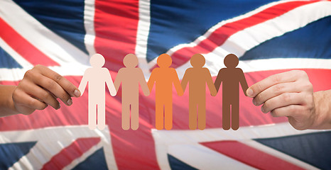 Image showing hands holding people pictogram over english flag