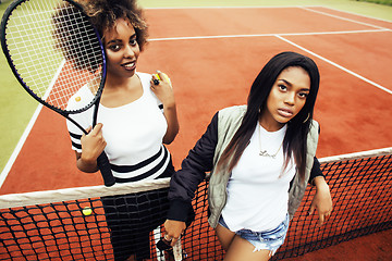 Image showing young pretty girlfriends hanging on tennis court, fashion stylis