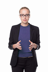 Image showing Business woman standing with arms crossed against white background..