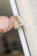 Image showing Professional Painter Cutting In With Brush to Paint House Door F