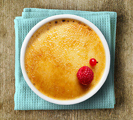 Image showing creme brule on wooden background