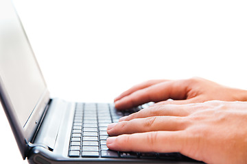 Image showing Businessman working on laptop over white