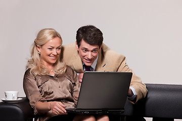 Image showing Young Woman And Man with a notebook