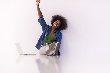 Image showing african american woman sitting on floor with laptop