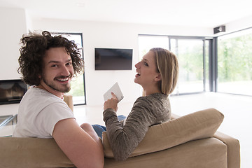 Image showing Rear view of couple watching television