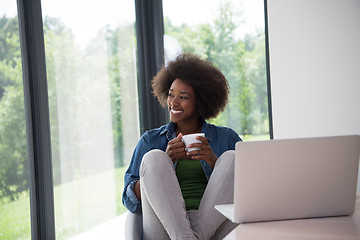 Image showing African American woman in the living room