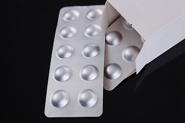 Image showing Silver blister pack of small pills