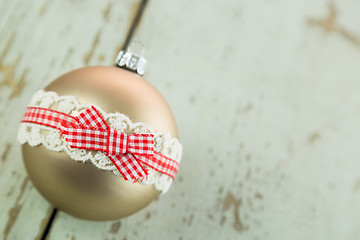 Image showing Three Christmas baubles on rustic wood