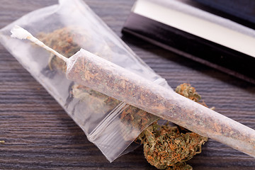 Image showing Dried Cannabis on Rolling Paper with Filter