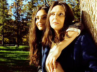 Image showing mature real mother with daughter outside autumn fall in park