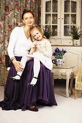 Image showing young mother with daughter at luxury home interior vintage