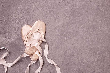 Image showing Ballet pointe shoes on pink background.