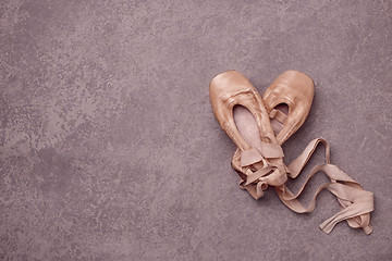 Image showing Ballet pointe shoes on pink background.