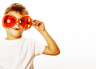 Image showing little cute boy in orange sunglasses pointing isolated close up 