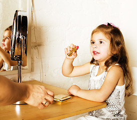 Image showing little cute girl with cosmetic, lifestyle people concept