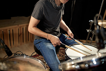 Image showing male musician playing drums and cymbals at concert