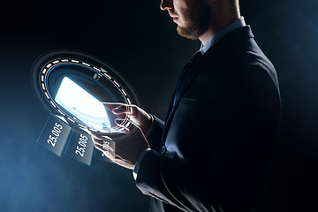 Image showing close up of businessman with transparent tablet pc