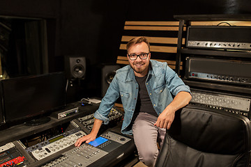 Image showing man at mixing console in music recording studio