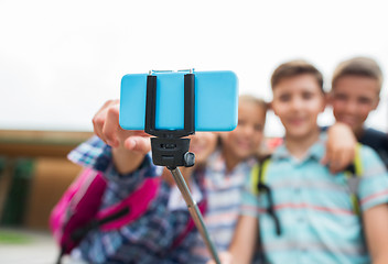 Image showing happy elementary school students taking selfie