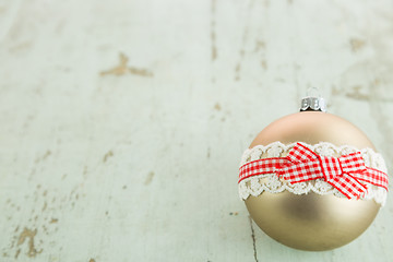 Image showing Three Christmas baubles on rustic wood